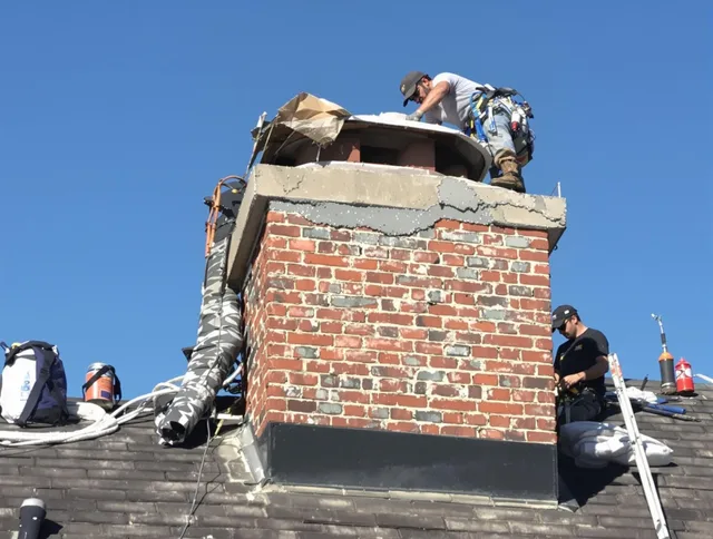 North Olmsted Chimney Sweep installing a custom chimney crown in North Olmsted, OH