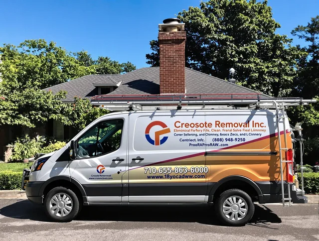 North Olmsted Chimney Sweep technician removing creosote safely in North Olmsted, OH