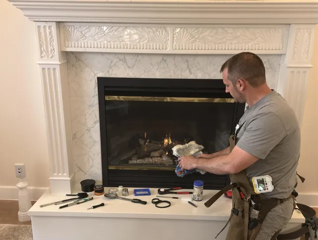 North Olmsted Chimney Sweep performing fireplace maintenance in North Olmsted, OH